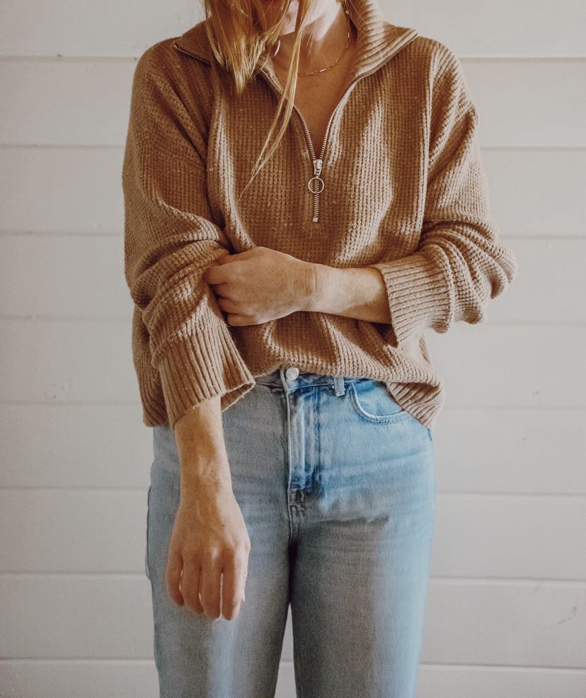 Sustainable women’s fashion from good/kind boutique in Port Alberni featuring vintage knit sweaters, high-waisted denim, and a pre-loved leather bag